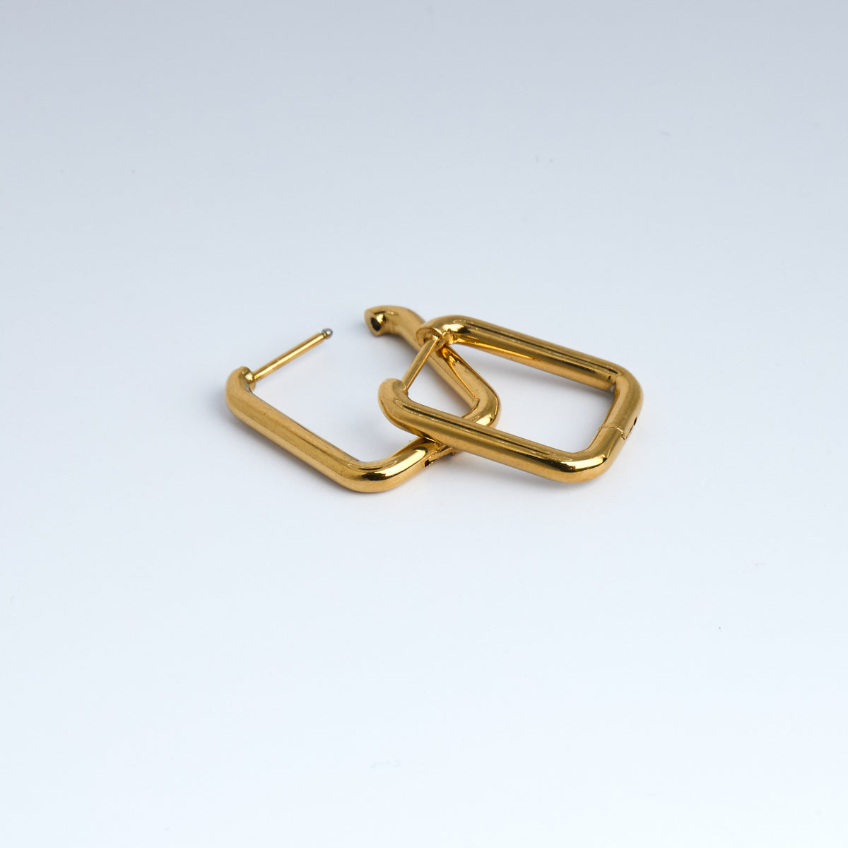Gold hoop earrings on a white background